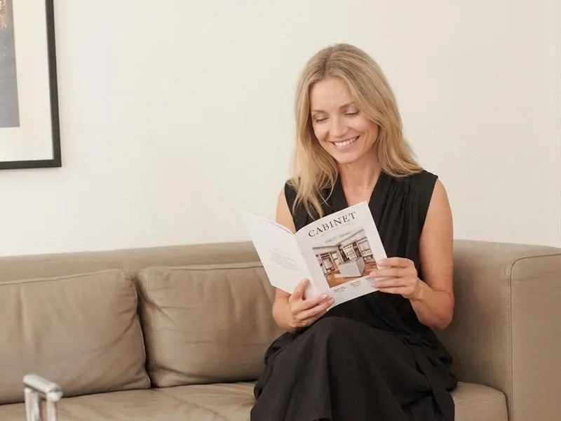 Person reading a CABINET brochure