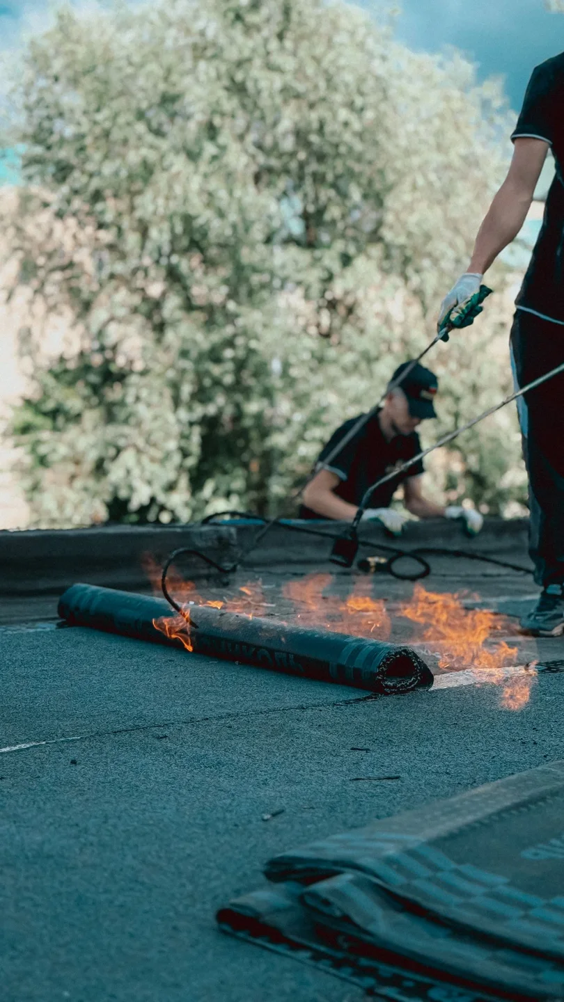 Torch-applied waterproofing membrane on a roof (stock photo)