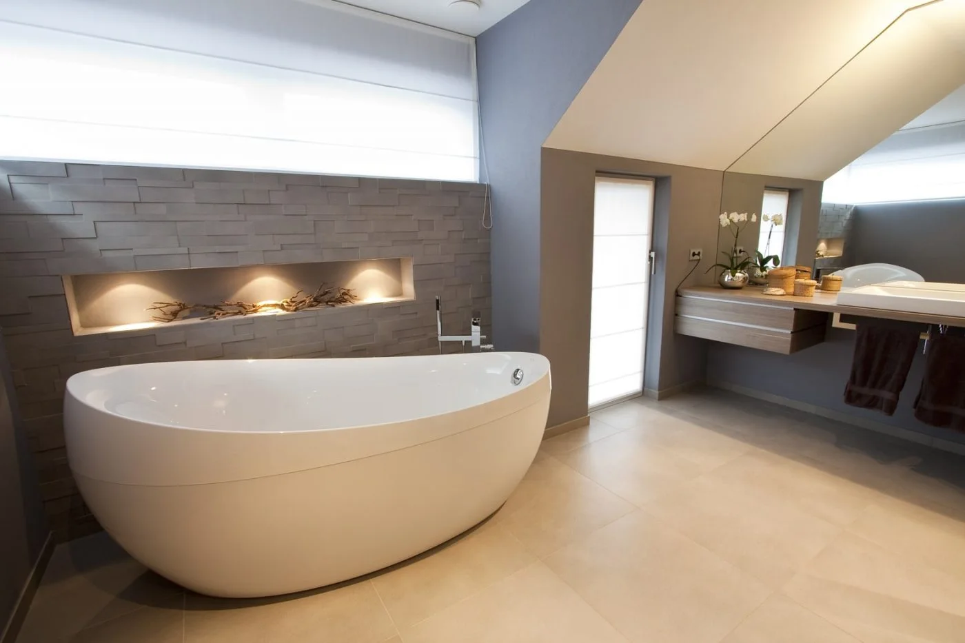 Private bathroom in Gonderange with a freestanding bath