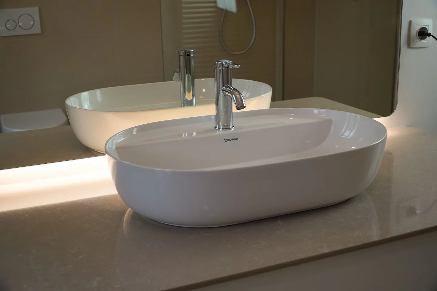 Countertop washbasin on a stone-look vanity