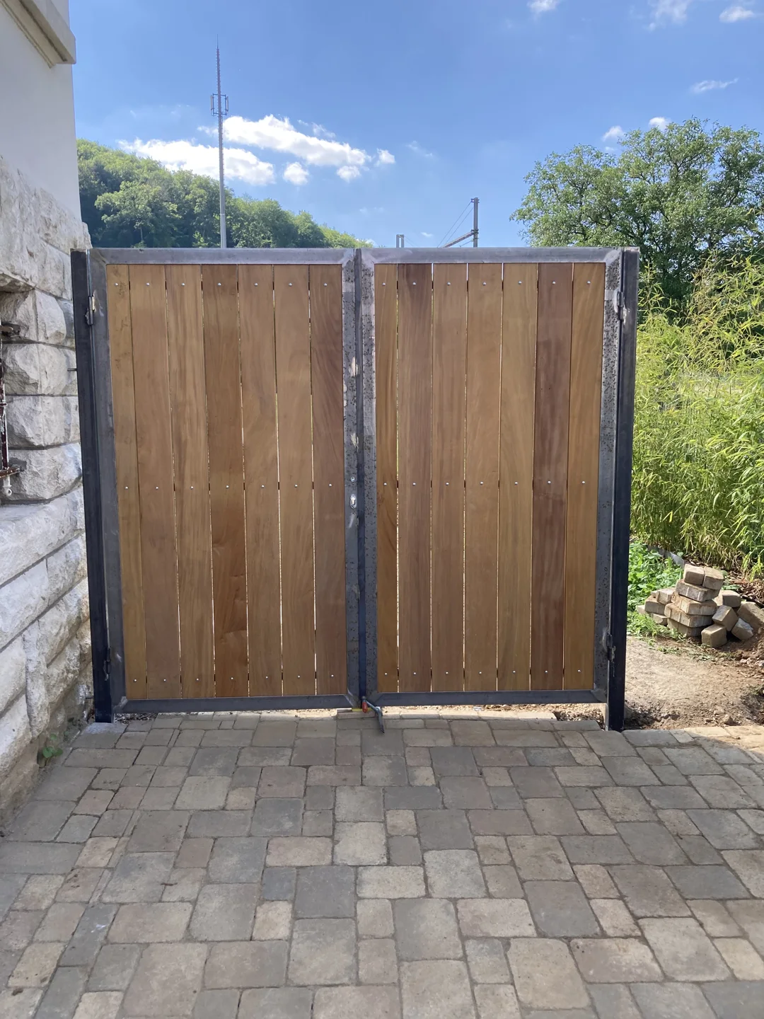 Wooden gate set into a stone wall