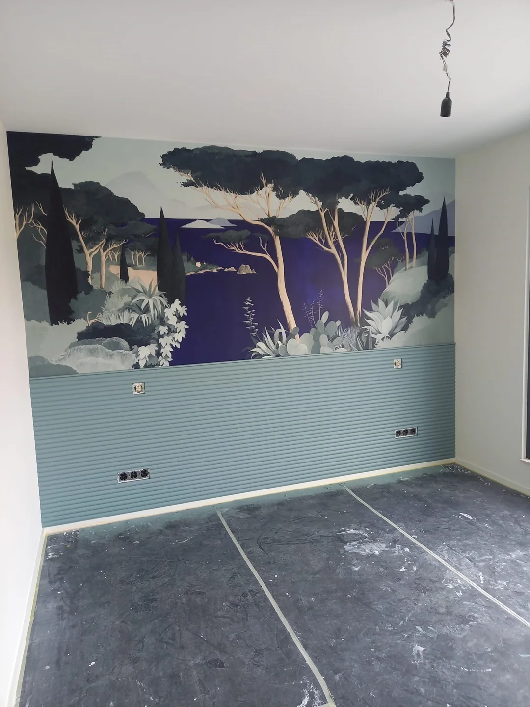 Panoramic landscape wallpaper above an Orac-style wainscot