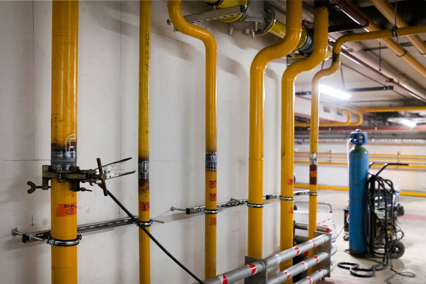 Yellow gas pipes and valves in a technical room