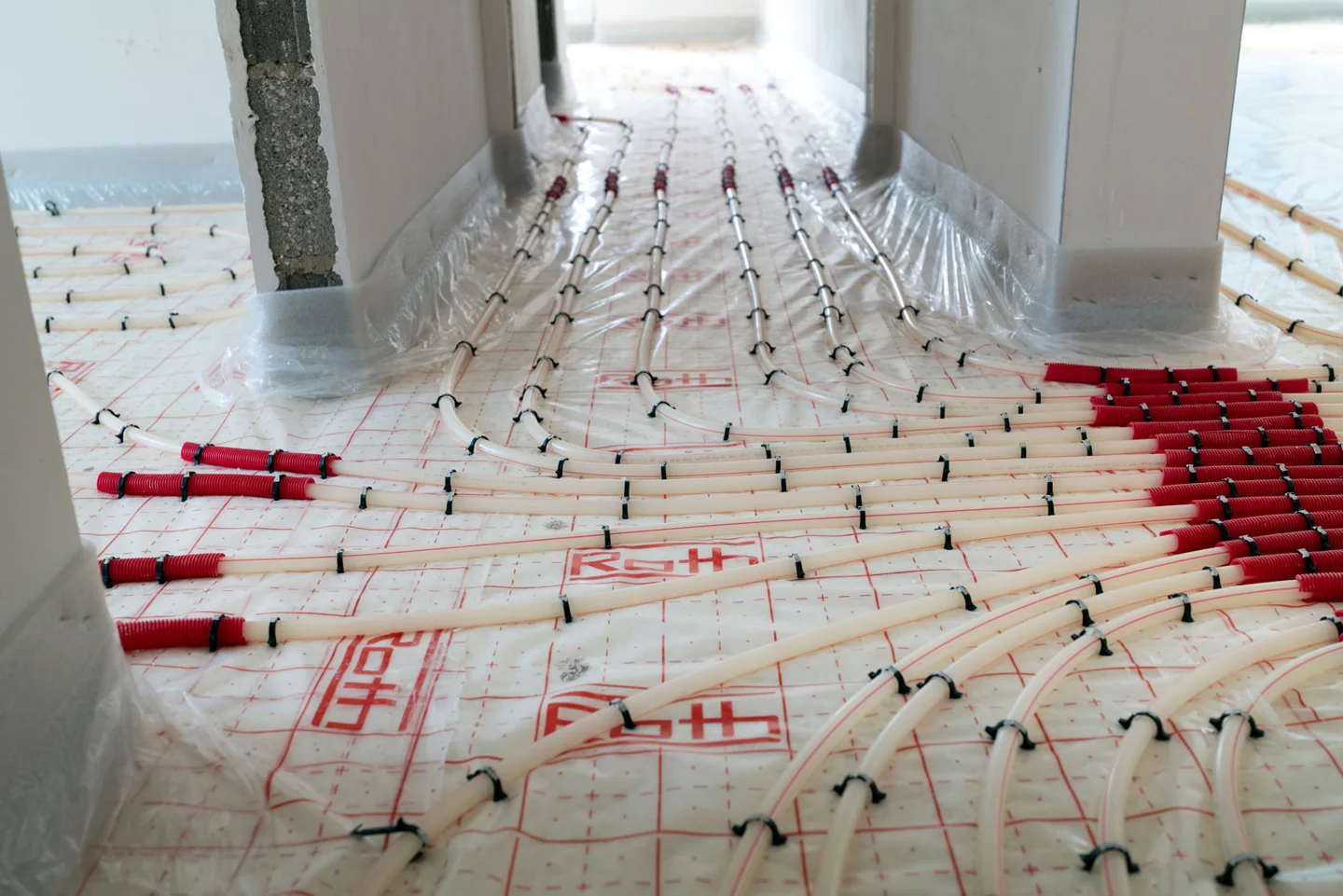 Underfloor heating loops laid before the screed