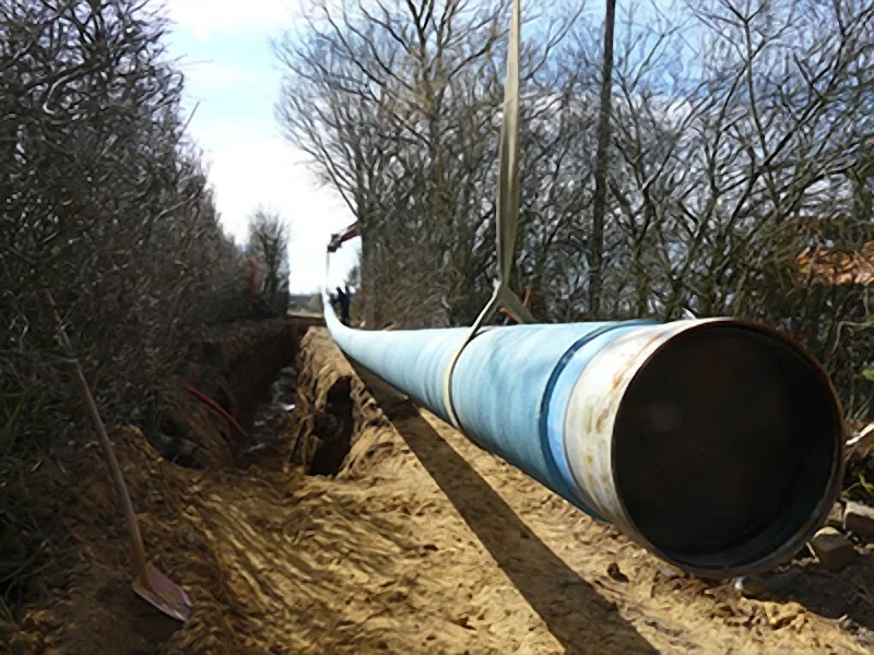 Large-diameter pipe laid in an open trench