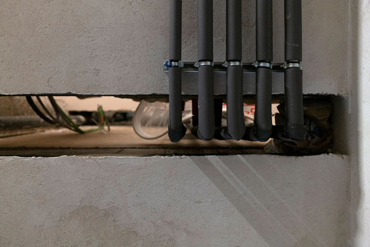 Supply pipes passing through a wall