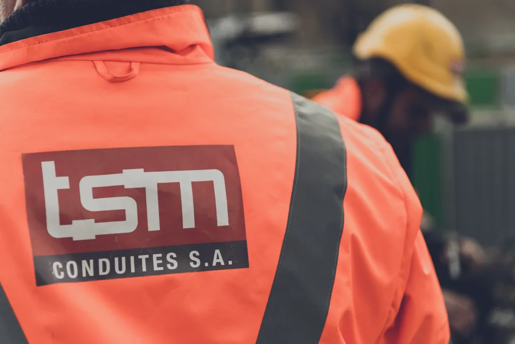 TSM Conduites technician in a high-visibility jacket