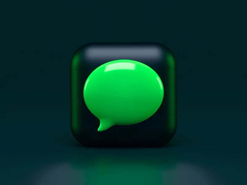 Green speech-bubble icon on a dark background.