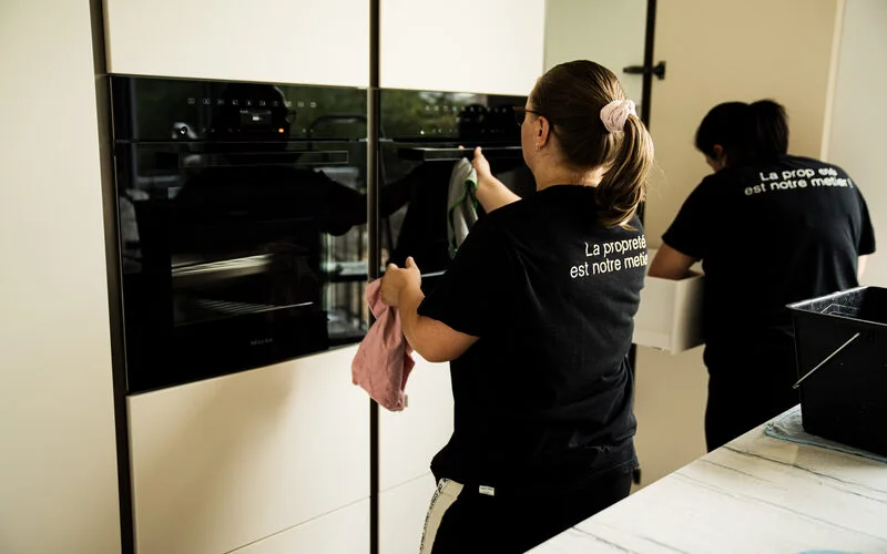 Two Cleanix cleaners in an office kitchen