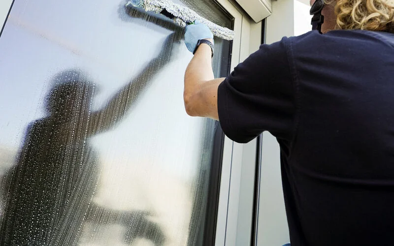 Window cleaning with a squeegee