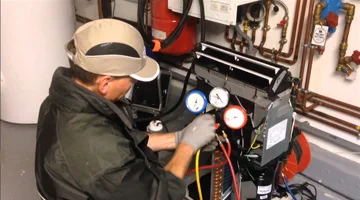 Technician working on mechanical equipment